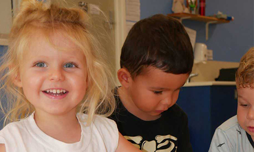 Smiling Girl at school 500x300 - Okinja Early Learning