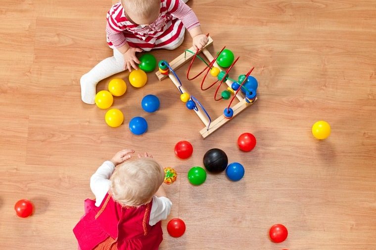 Two Two year olds playing a fun activity