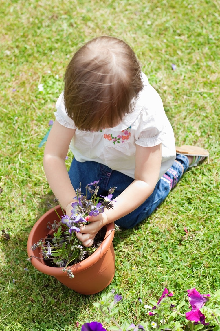 activities for 3-year-olds-little girl planting a flower
