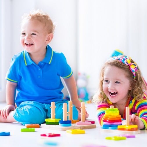 nurturing creativity in early childhood – little boy and girl smiling while playing nurturing creativity in early childhood - little boy and girl smiling while playing