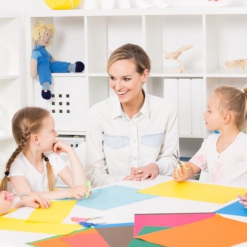 School Readiness Activities For Preschoolers – teacher and children doing a paper activity School Readiness Activities For Preschoolers - teacher and children doing a paper activity