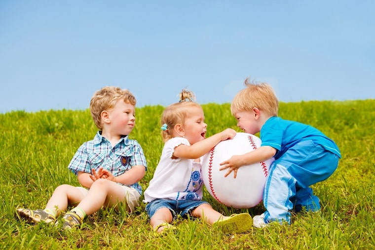outdoor games for toddlers - children playing with a ball outdoors