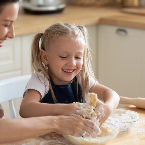 cooking with toddlers – mother and child kneading dough cooking with toddlers - mother and child kneading dough
