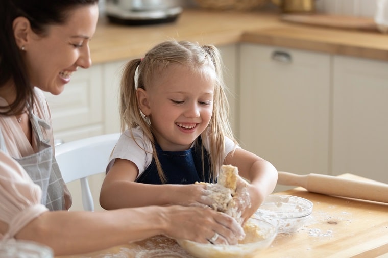 cooking with toddlers - mother and child kneading dough