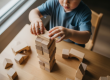 Toddler developing fine motor skills and problem-solving through construction play at Sunshine Coast early learning centre